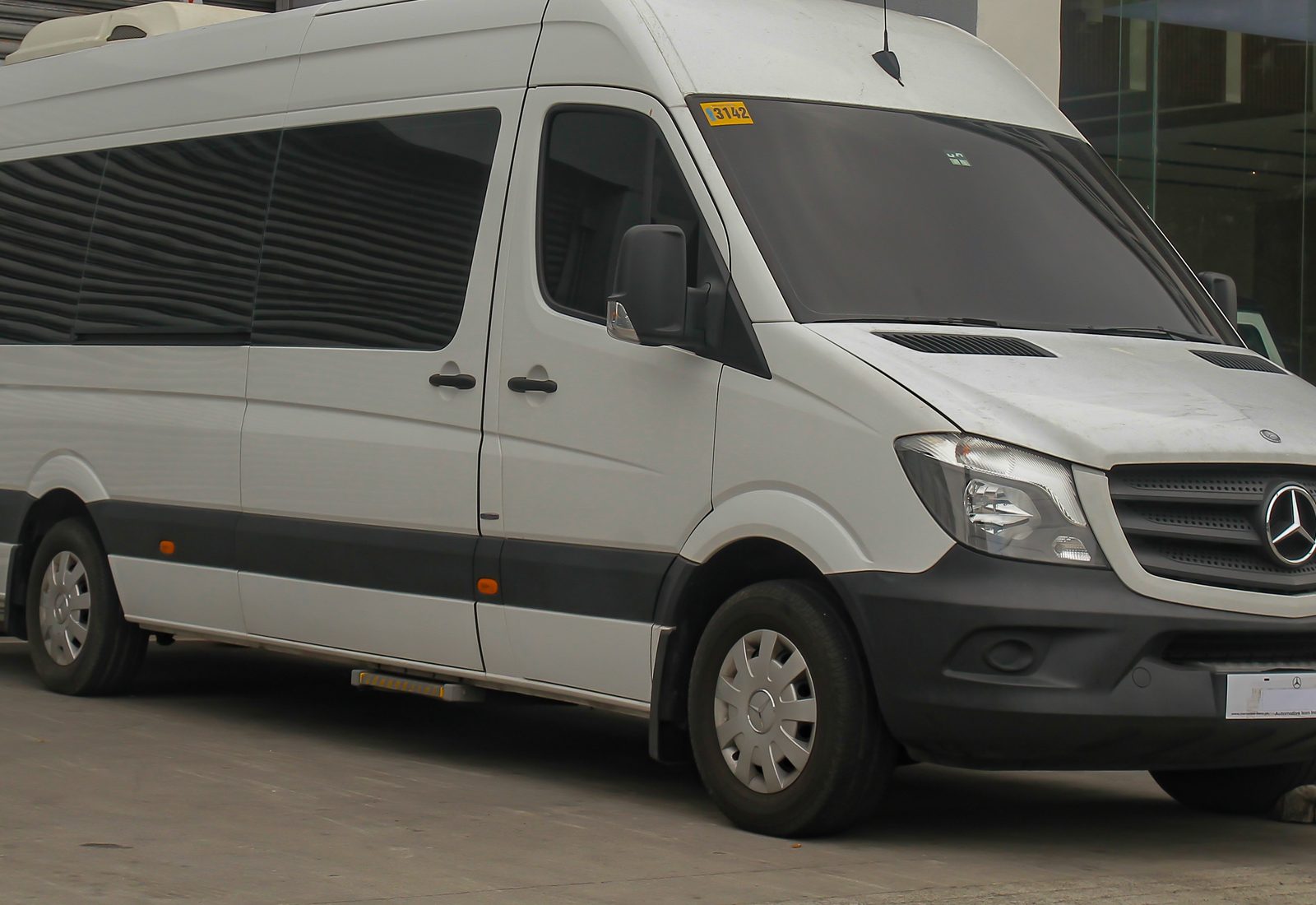 White Mercedes-Benz Sprinter 3500XD passenger minibus, front three-quarter view